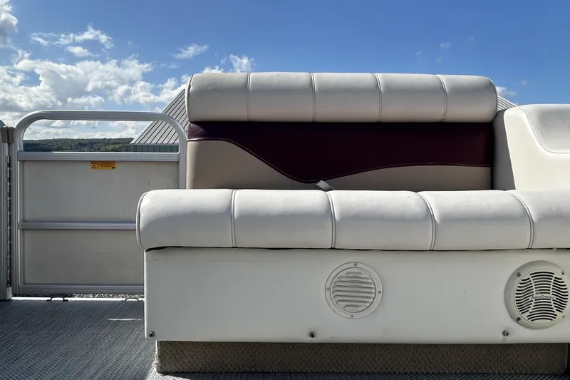 Slide: The Image of Interior of a 2003 Sweetwater 2019RE boat showing seating and storage compartment. - 62