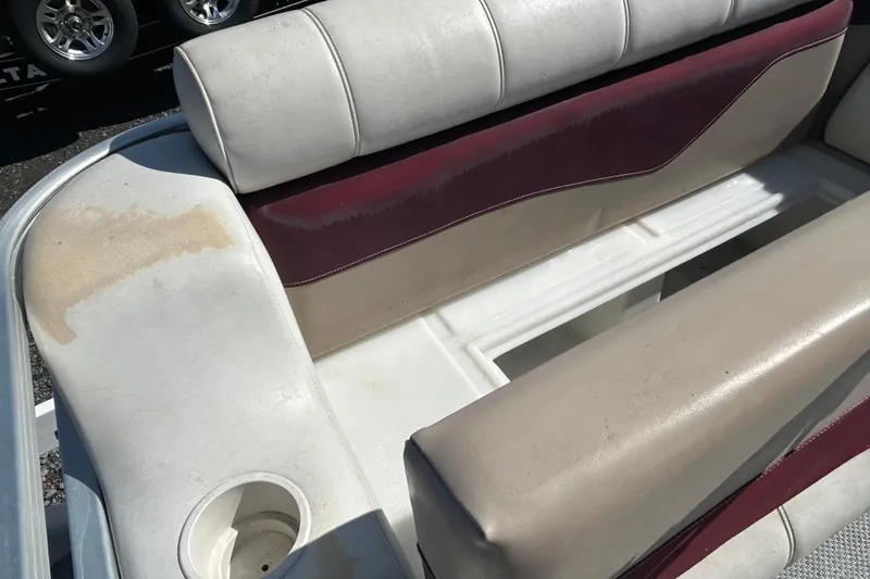 Slide: The Image of Pontoon boat interior with maroon and beige seating, Sweetwater 2019RE model, 2003. - 64