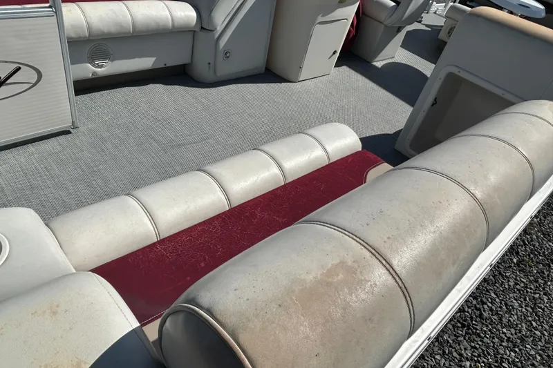 Slide: The Image of White and maroon boat seat on a 2003 Sweetwater 2019RE model. - 66