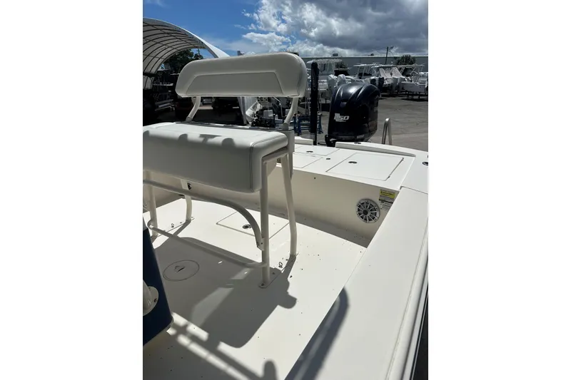 Slide: The Image of 2014 Pathfinder 2300 HPS boat with seating and Yamaha 150 engine, under cloudy sky. - 3