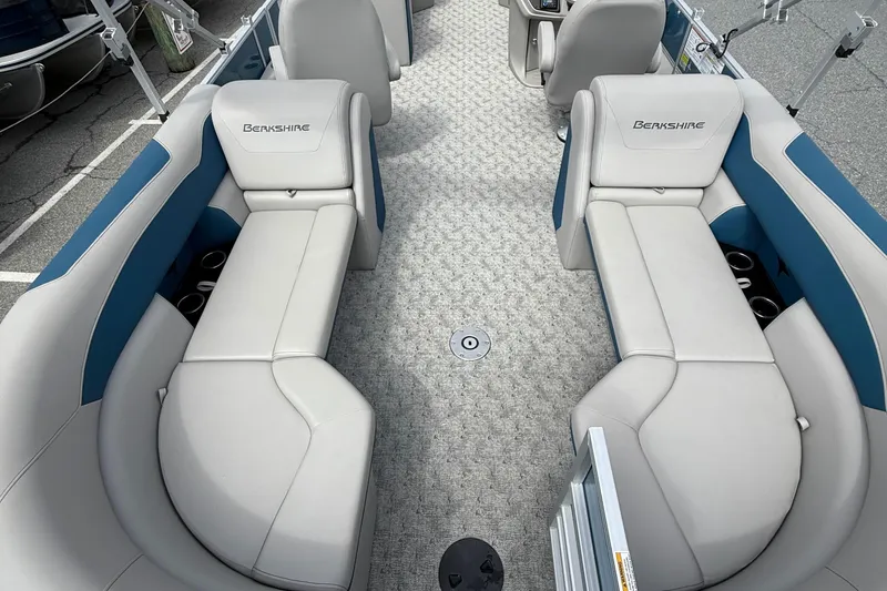 Slide: The Image of 2025 Berkshire 24RFX LE 2.75 pontoon boat interior with gray and blue seating. - 10