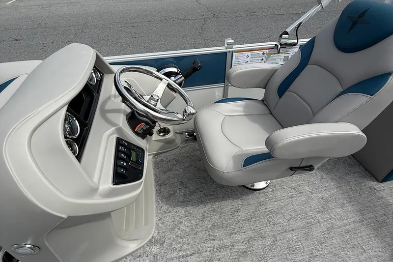 Slide: The Image of Captain's chair and helm of 2025 Berkshire 24RFX LE 2.75 pontoon boat. - 12