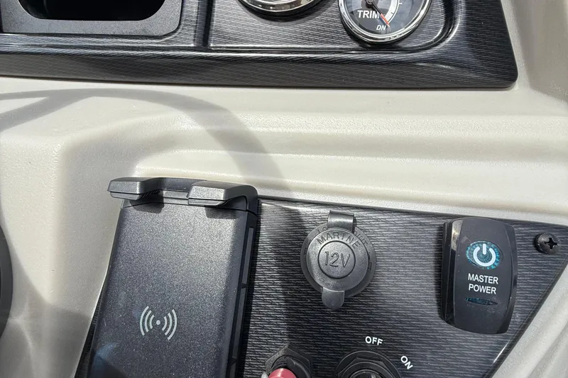 Slide: The Image of Control panel of 2025 Berkshire 24RFX LE 2.75 with power and charging features. - 14