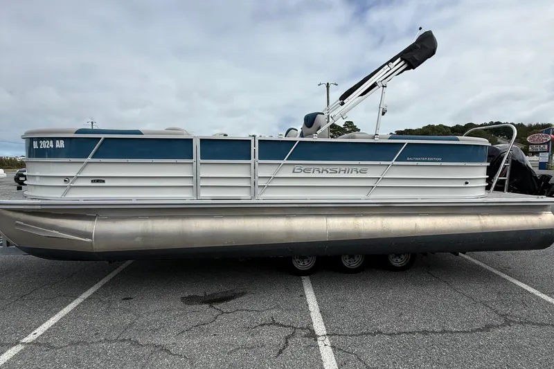 Slide: The Image of 2025 Berkshire 24RFX LE 2.75 pontoon boat in parking lot, side view. - 5