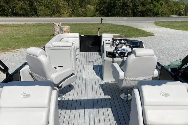 Slide: The Image of 2023 G3 Suncatcher Select Series 322RC pontoon boat interior with plush seating and steering console. - 10