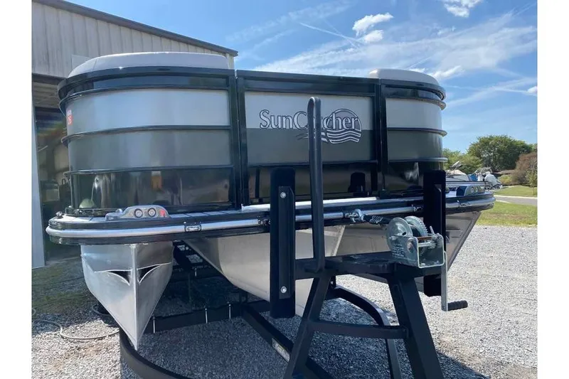 Slide: The Image of 2023 G3 Suncatcher Select Series 322RC pontoon boat on trailer, sunny day. - 3