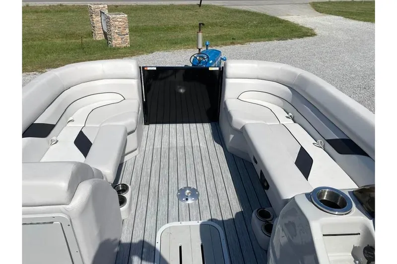 Slide: The Image of 2023 G3 Suncatcher Select Series 322RC pontoon boat interior with plush seating and cup holders. - 5