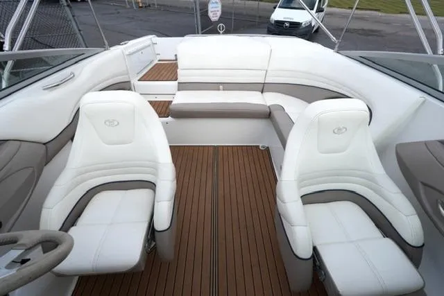 Slide: The Image of Interior of 2000 Cobalt 226 boat with white seating and wooden flooring. - 12