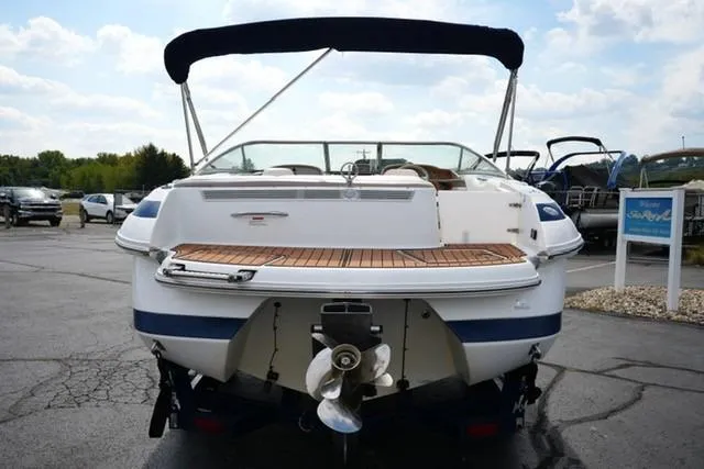 Slide: The Image of Rear view of a 2000 Cobalt 226 boat with teak swim platform and canopy. - 3