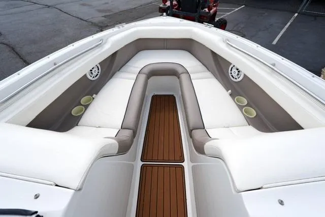 Slide: The Image of Interior view of 2000 Cobalt 226 boat with white seating and wooden flooring. - 5