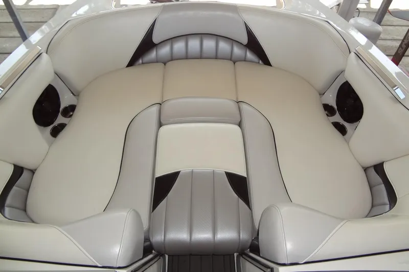Slide: The Image of 2017 MB SPORTS F22 Tomcat boat interior with beige and gray seating. - 10