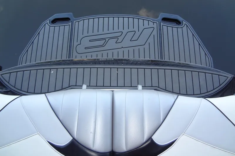 Slide: The Image of 2017 MB SPORTS F22 Tomcat swim platform and seating, featuring sleek design and logo. - 23