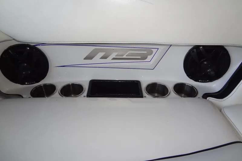 Slide: The Image of 2017 MB SPORTS F22 Tomcat interior with speakers and cup holders. - 25