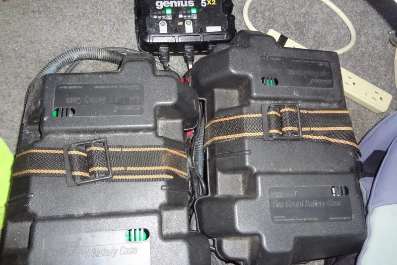 Slide: The Image of Battery cases and charger in 2017 MB SPORTS F22 Tomcat boat interior. - 32