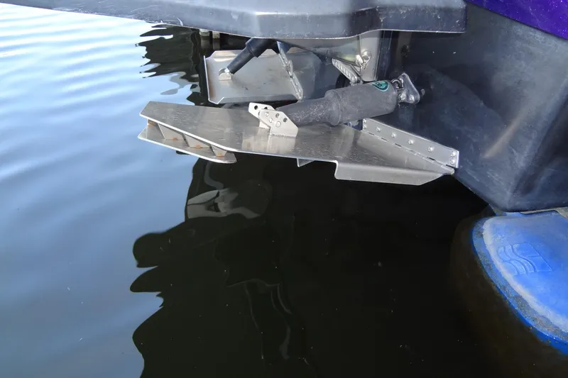 Slide: The Image of 2017 MB SPORTS F22 Tomcat boat with metal trim tabs in water. - 34