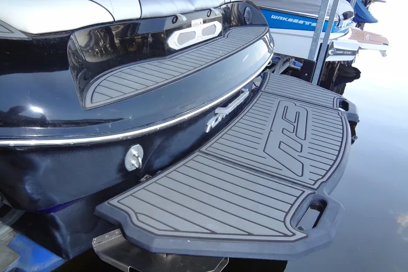 Slide: The Image of 2017 MB SPORTS F22 Tomcat boat with sleek swim platform design. - 6