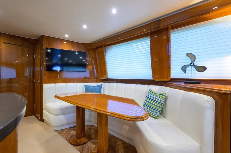 Slide: The Image of Luxurious interior of 2014 Viking 76 Enclosed Bridge Convertible yacht with elegant seating and decor. - 10