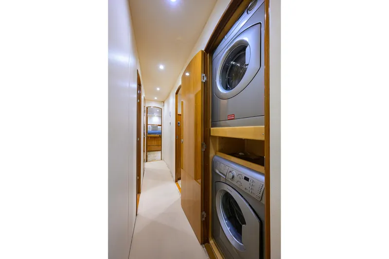 Slide: The Image of Laundry area in 2014 Viking 76 Enclosed Bridge Convertible yacht hallway. - 17