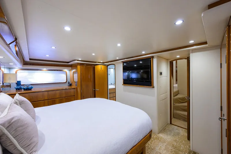 Slide: The Image of Luxurious bedroom interior of 2014 Viking 76 Enclosed Bridge Convertible yacht. - 19