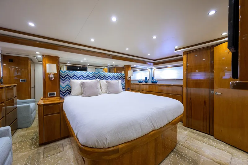 Slide: The Image of Luxurious bedroom interior of 2014 Viking 76 Enclosed Bridge Convertible yacht. - 2