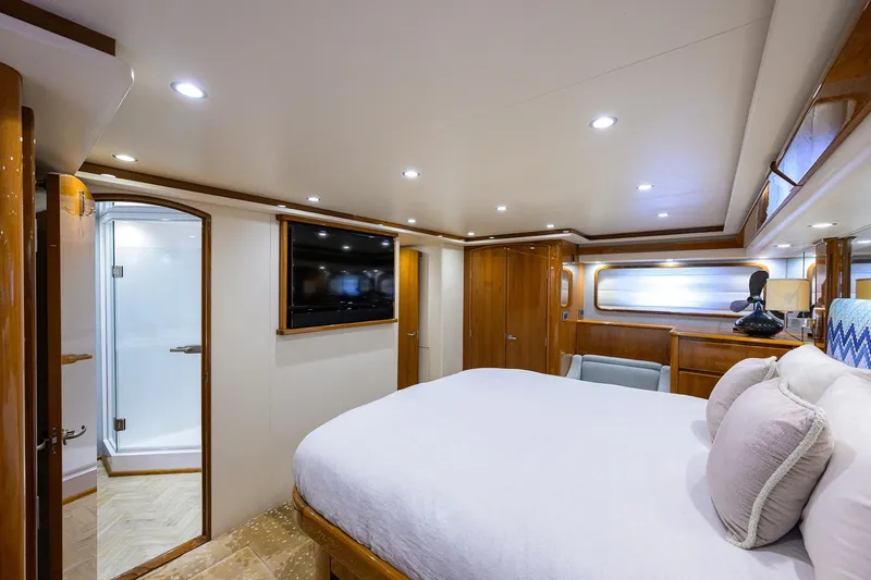 Slide: The Image of Luxurious bedroom interior of 2014 Viking 76 Enclosed Bridge Convertible yacht. - 21