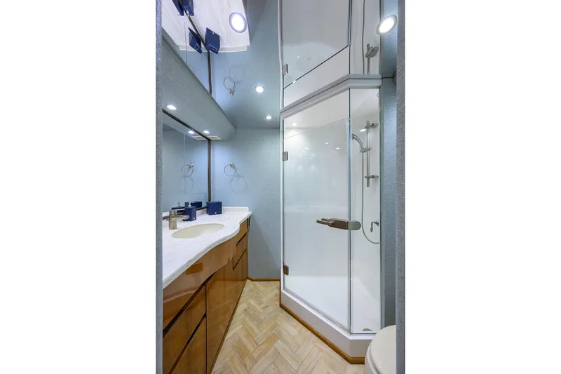 Slide: The Image of Luxurious bathroom in 2014 Viking 76 Enclosed Bridge Convertible yacht with modern shower. - 24
