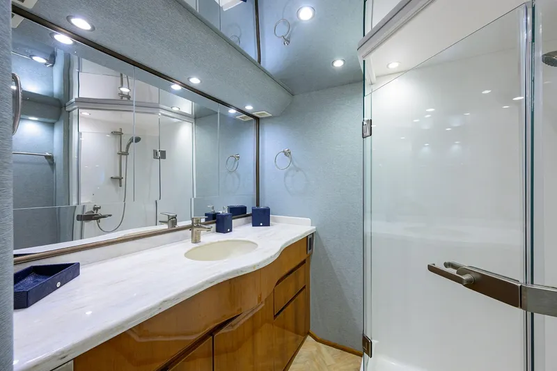 Slide: The Image of Luxurious bathroom in 2014 Viking 76 Enclosed Bridge Convertible yacht. - 25