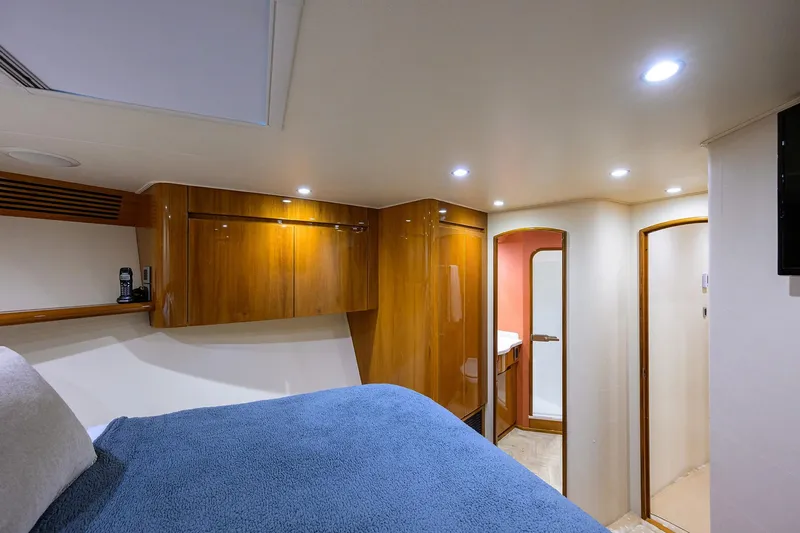 Slide: The Image of Luxurious cabin interior of 2014 Viking 76 Enclosed Bridge Convertible yacht. - 27