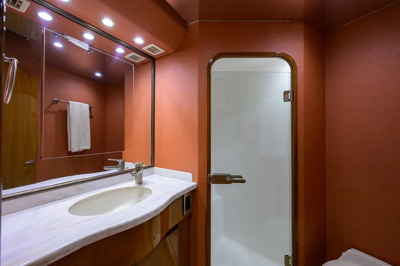 Slide: The Image of Luxurious bathroom in 2014 Viking 76 Enclosed Bridge Convertible yacht with modern fixtures. - 28