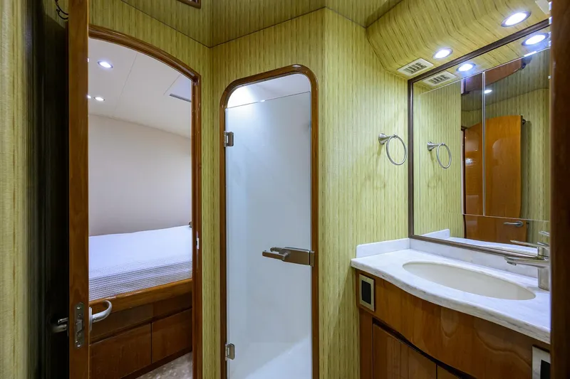 Slide: The Image of Luxurious bathroom interior of 2014 Viking 76 Enclosed Bridge Convertible yacht. - 31