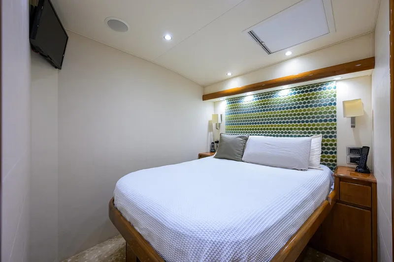 Slide: The Image of Luxurious bedroom interior of 2014 Viking 76 Enclosed Bridge Convertible yacht. - 32