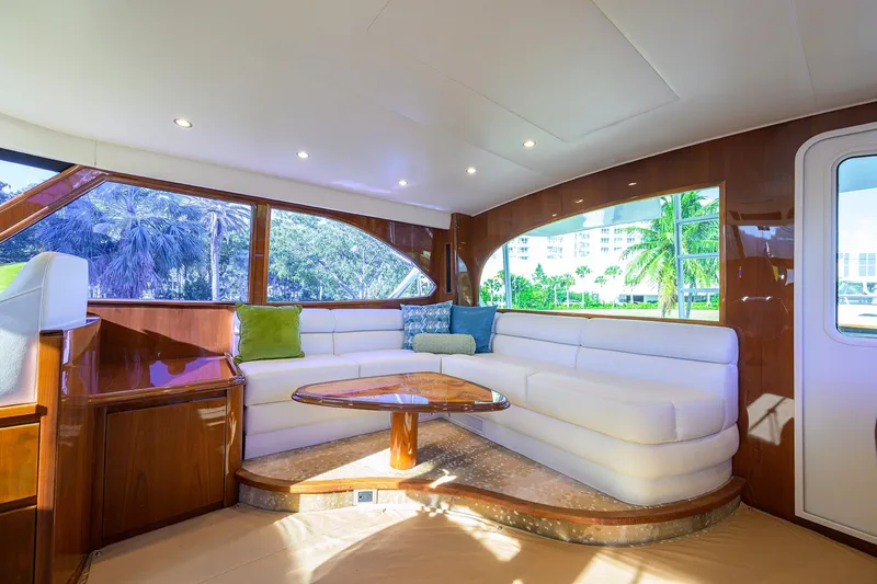 Slide: The Image of Luxurious interior of 2014 Viking 76 Enclosed Bridge Convertible yacht with plush seating. - 38