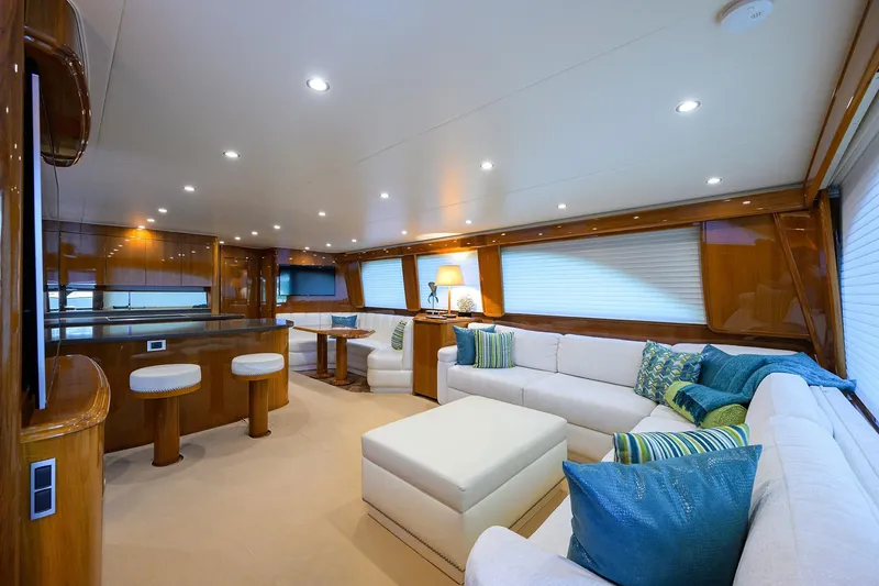 Slide: The Image of Luxurious interior of 2014 Viking 76 Enclosed Bridge Convertible yacht with elegant seating and decor. - 4