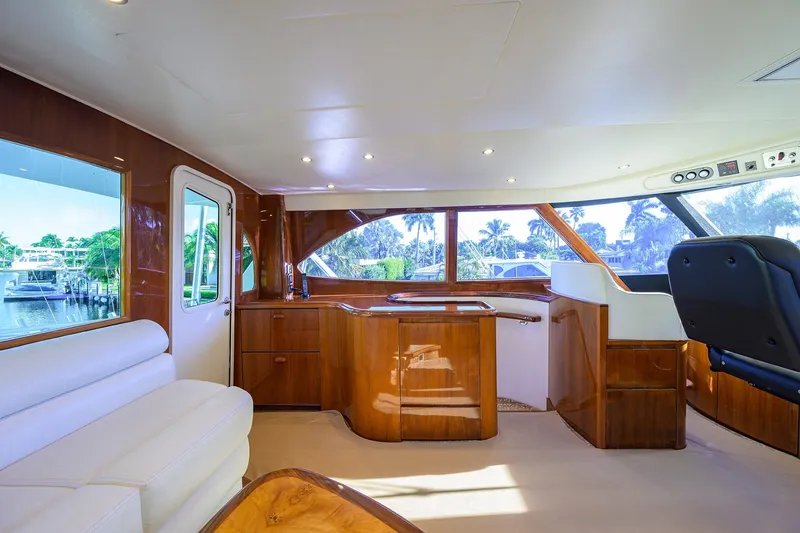 Slide: The Image of Luxurious interior of 2014 Viking 76 Enclosed Bridge Convertible yacht with elegant wood finishes. - 40