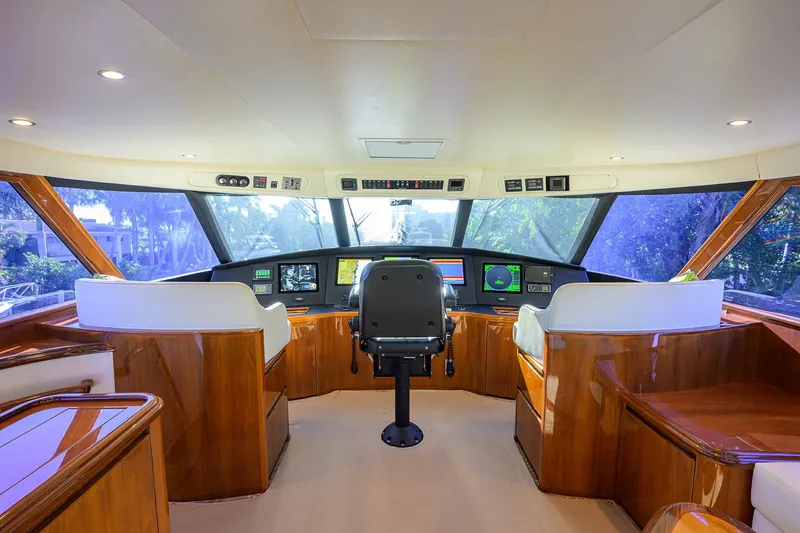 Slide: The Image of Luxurious helm of 2014 Viking 76 Enclosed Bridge Convertible yacht with advanced navigation systems. - 42