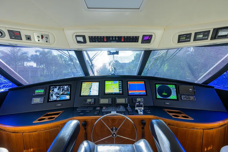 Slide: The Image of Cockpit of 2014 Viking 76 Enclosed Bridge Convertible with advanced navigation systems. - 43