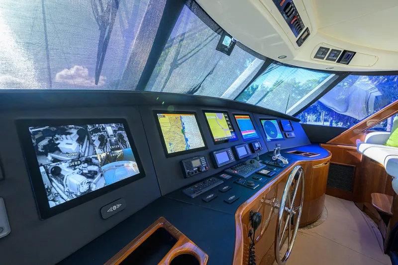 Slide: The Image of Bridge of 2014 Viking 76 Enclosed Bridge Convertible yacht with advanced navigation systems. - 45