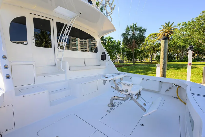 Slide: The Image of 2014 Viking 76 Enclosed Bridge Convertible yacht with spacious deck and fishing chair. - 56