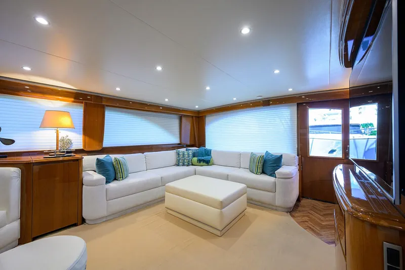 Slide: The Image of Luxurious interior of 2014 Viking 76 Enclosed Bridge Convertible yacht with elegant seating and lighting. - 6
