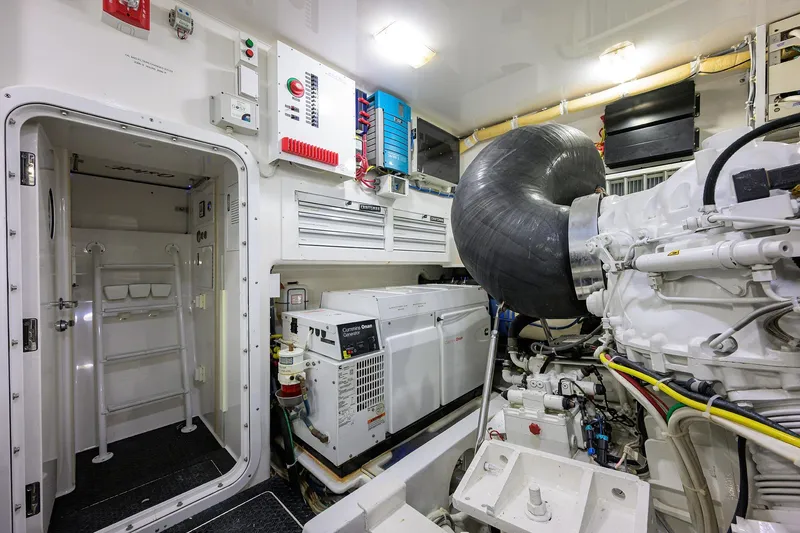 Slide: The Image of Engine room of 2014 Viking 76 Enclosed Bridge Convertible yacht, featuring advanced machinery. - 66