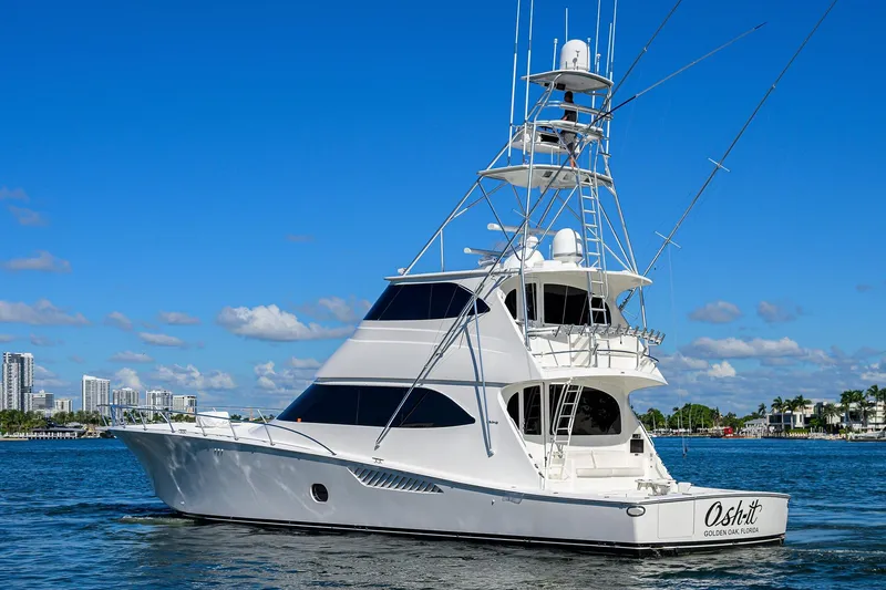 Slide: The Image of 2014 Viking 76 Enclosed Bridge Convertible yacht cruising on a sunny day. - 75