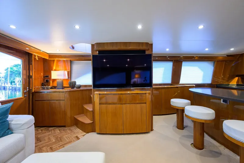 Slide: The Image of Luxurious interior of 2014 Viking 76 Enclosed Bridge Convertible yacht with modern amenities. - 8