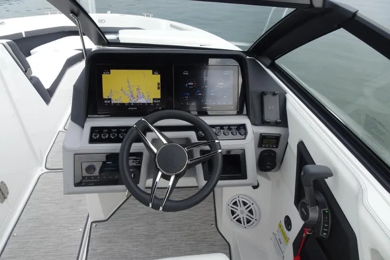 Slide: The Image of 2026 Cobalt R6 boat dashboard with steering wheel and navigation screens. - 13
