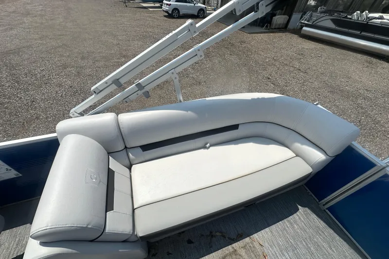 Slide: The Image of 2024 Godfrey SWEETWATER 2286 SB boat with white cushioned seating on deck. - 11