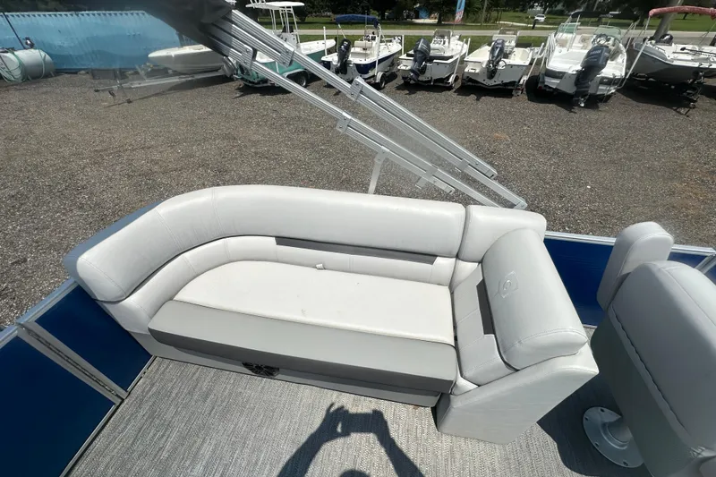 Slide: The Image of 2024 Godfrey SWEETWATER 2286 SB pontoon boat with gray seating and outdoor setting. - 12