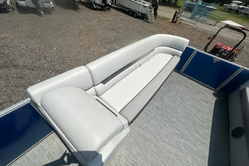 Slide: The Image of 2024 Godfrey SWEETWATER 2286 SB pontoon boat with white seating and blue paneling. - 14