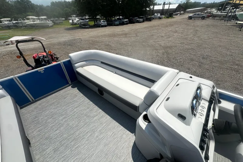 Slide: The Image of 2024 Godfrey SWEETWATER 2286 SB pontoon boat interior with seating and control panel. - 15
