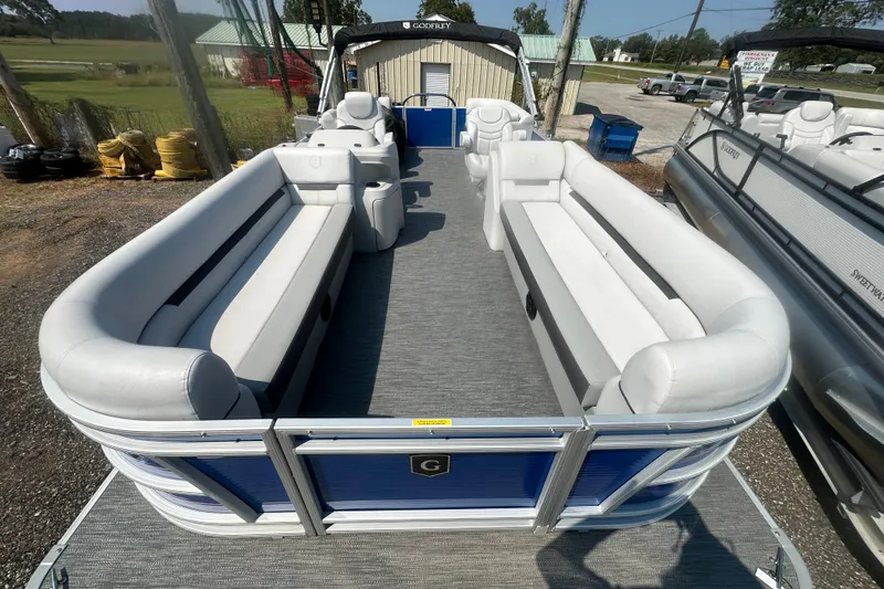 Slide: The Image of 2024 Godfrey SWEETWATER 2286 SB pontoon boat with spacious seating and modern design. - 25