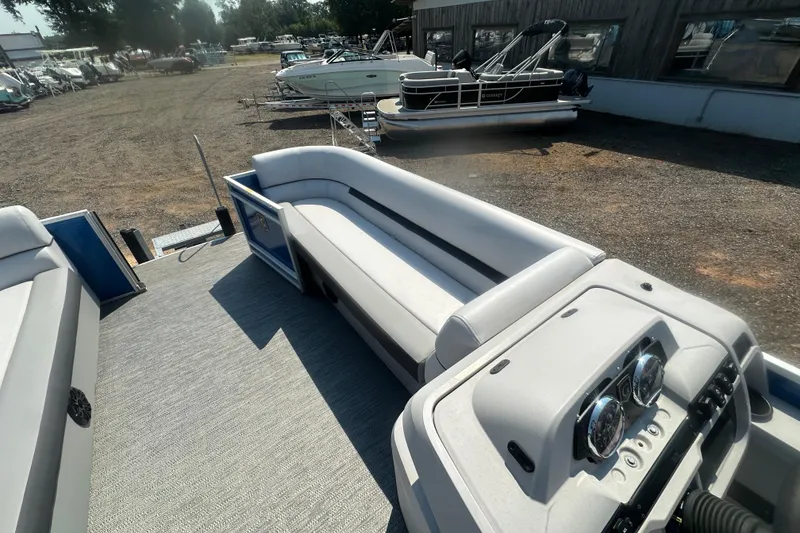 Slide: The Image of 2024 Godfrey SWEETWATER 2286 SB pontoon boat interior with seating and control panel. - 32