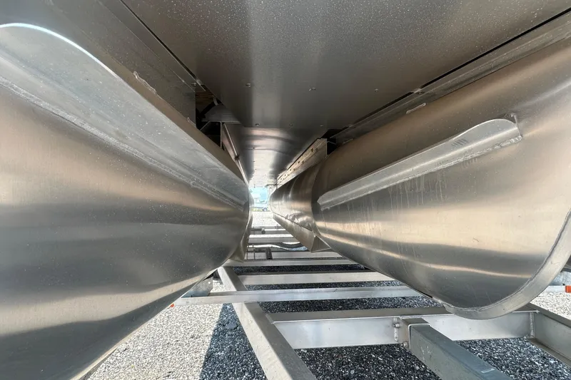 Slide: The Image of Underneath view of 2024 Godfrey SWEETWATER 2286 SB pontoon boat, showcasing aluminum pontoons. - 9